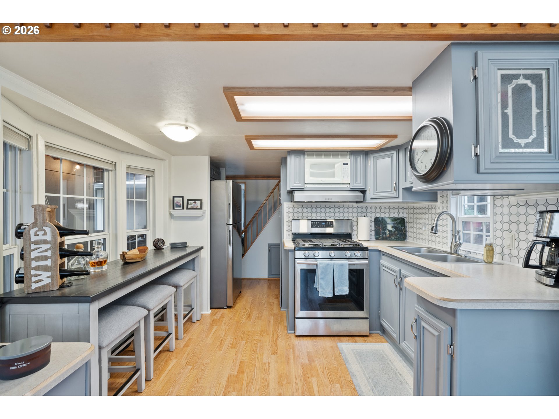 37395 North Fork Road, Unit 13 Nehalem, OR 97131 - Photo 15 of 34 a kitchen with stainless steel appliances a stove a sink and a refrigerator