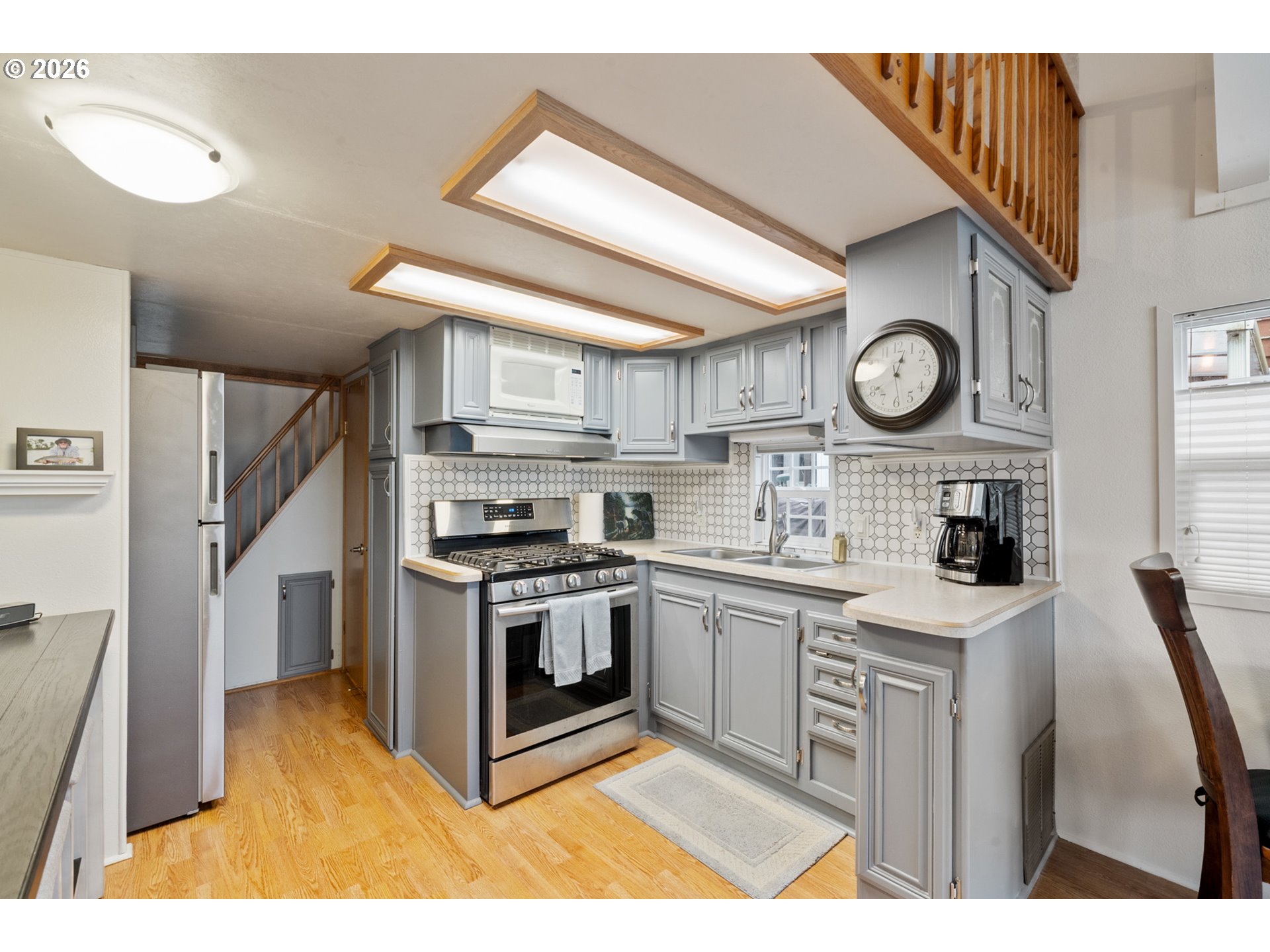 37395 North Fork Road, Unit 13 Nehalem, OR 97131 - Photo 16 of 34 a kitchen with stainless steel appliances granite countertop a stove and a sink