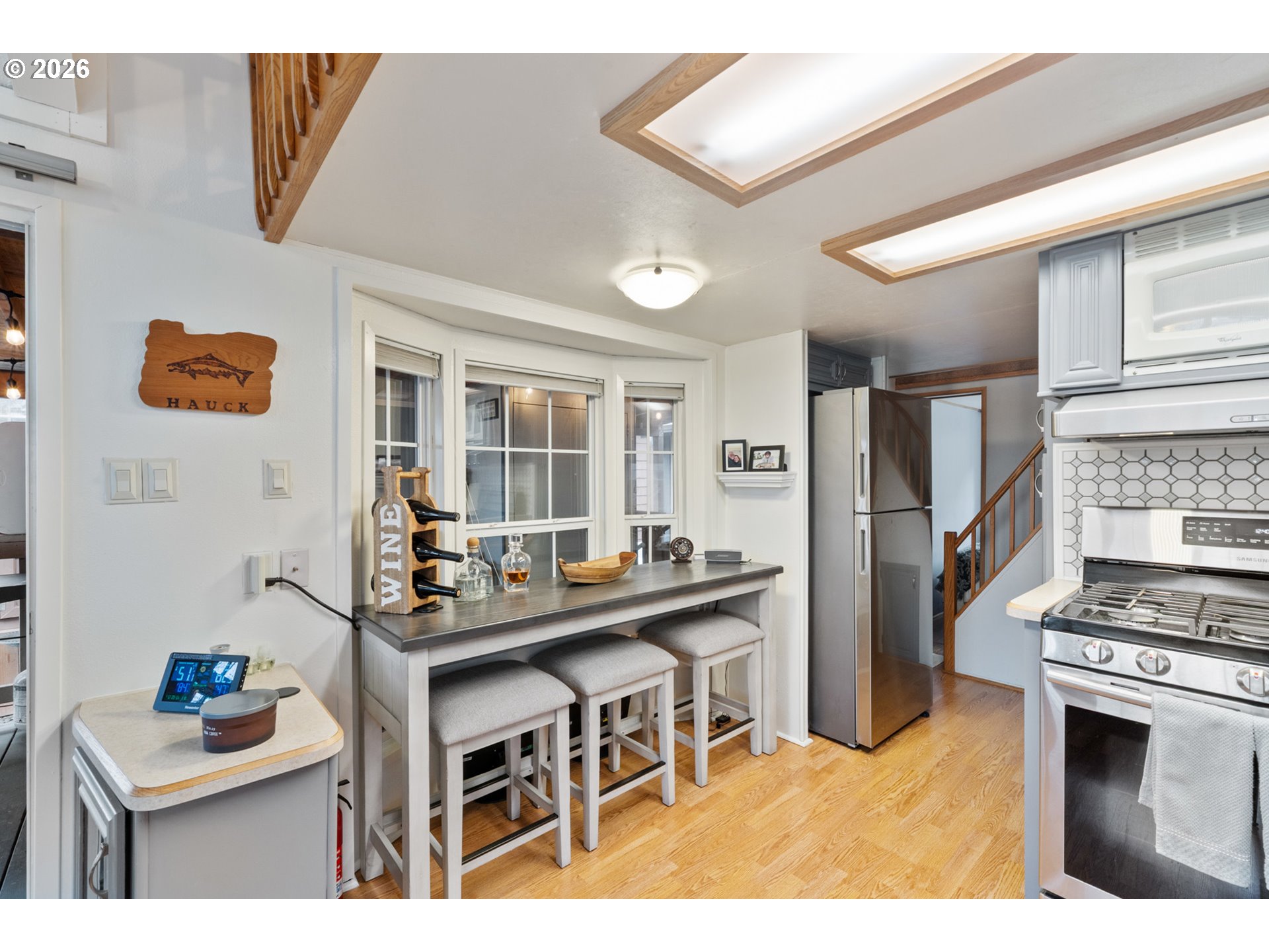 37395 North Fork Road, Unit 13 Nehalem, OR 97131 - Photo 17 of 34 a kitchen with stainless steel appliances kitchen island granite countertop a stove and a sink