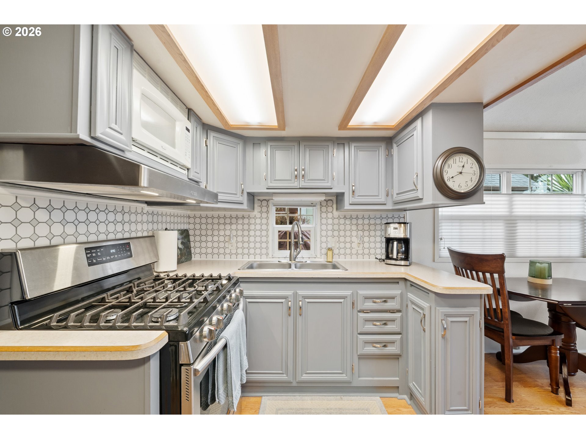 37395 North Fork Road, Unit 13 Nehalem, OR 97131 - Photo 18 of 34 a kitchen with cabinets and stainless steel appliances