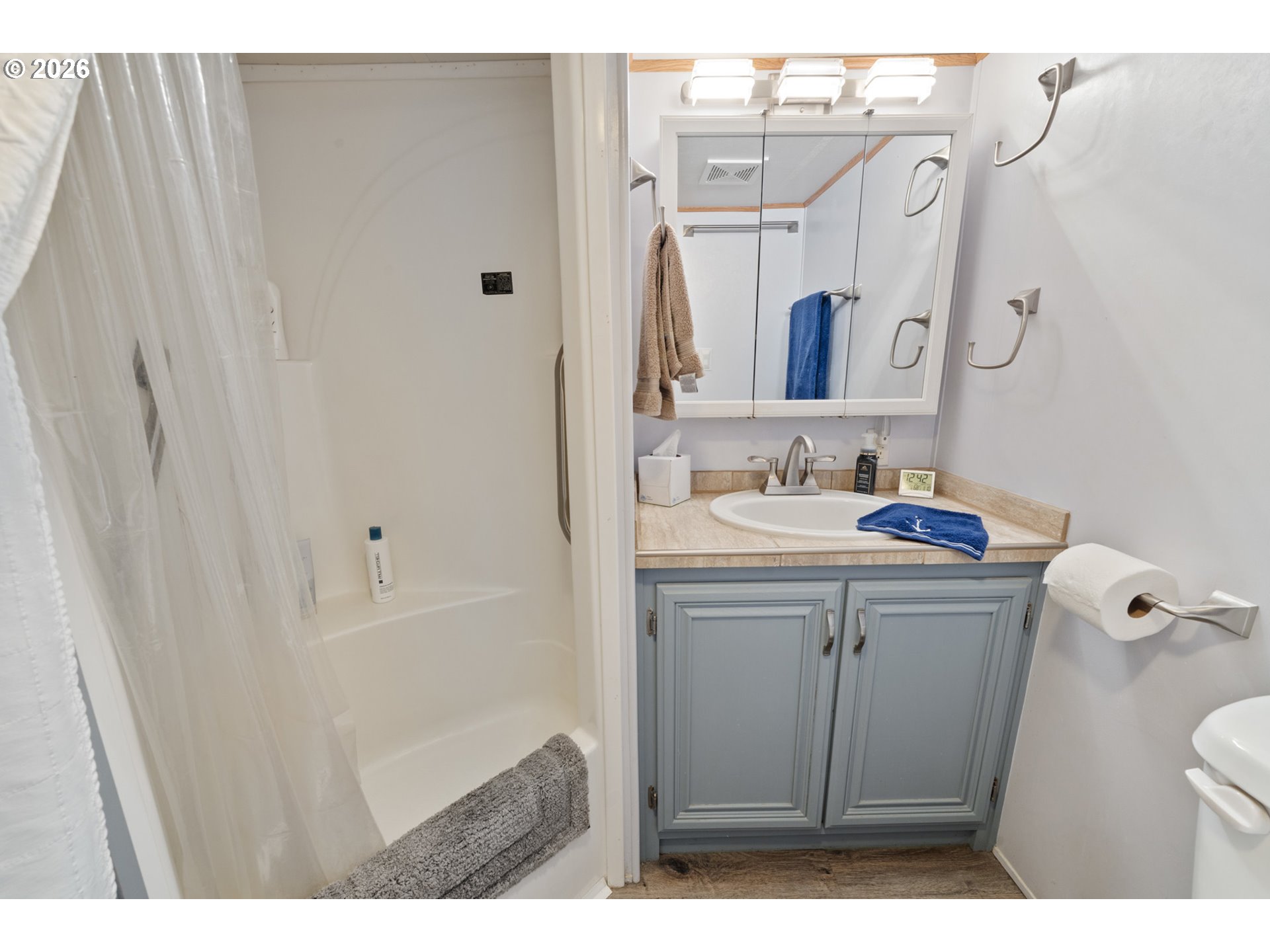 37395 North Fork Road, Unit 13 Nehalem, OR 97131 - Photo 20 of 34 a bathroom with a sink a toilet and shower
