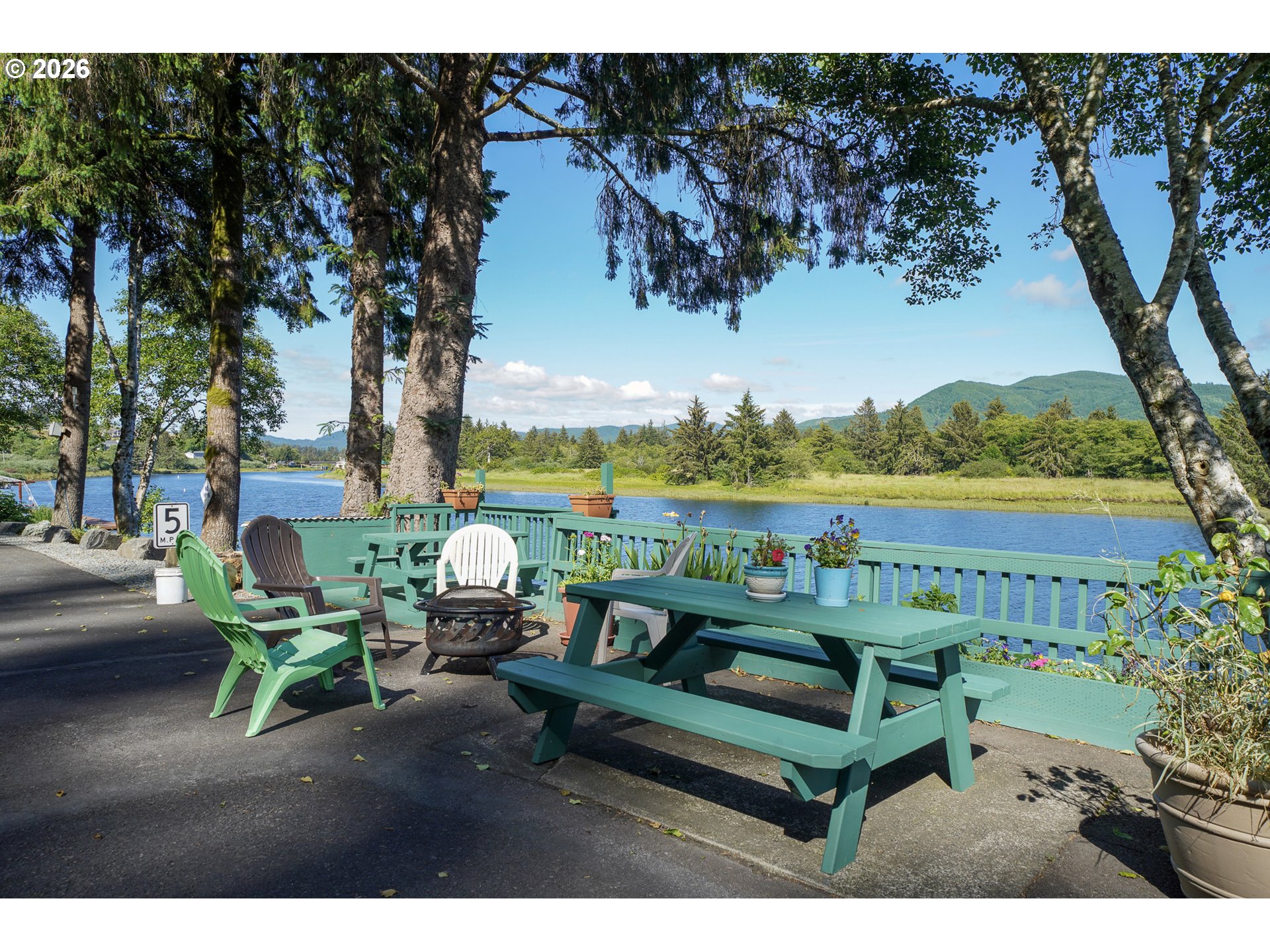 37395 North Fork Road, Unit 13 Nehalem, OR 97131 - Photo 30 of 34 a view of a lake with couches in patio