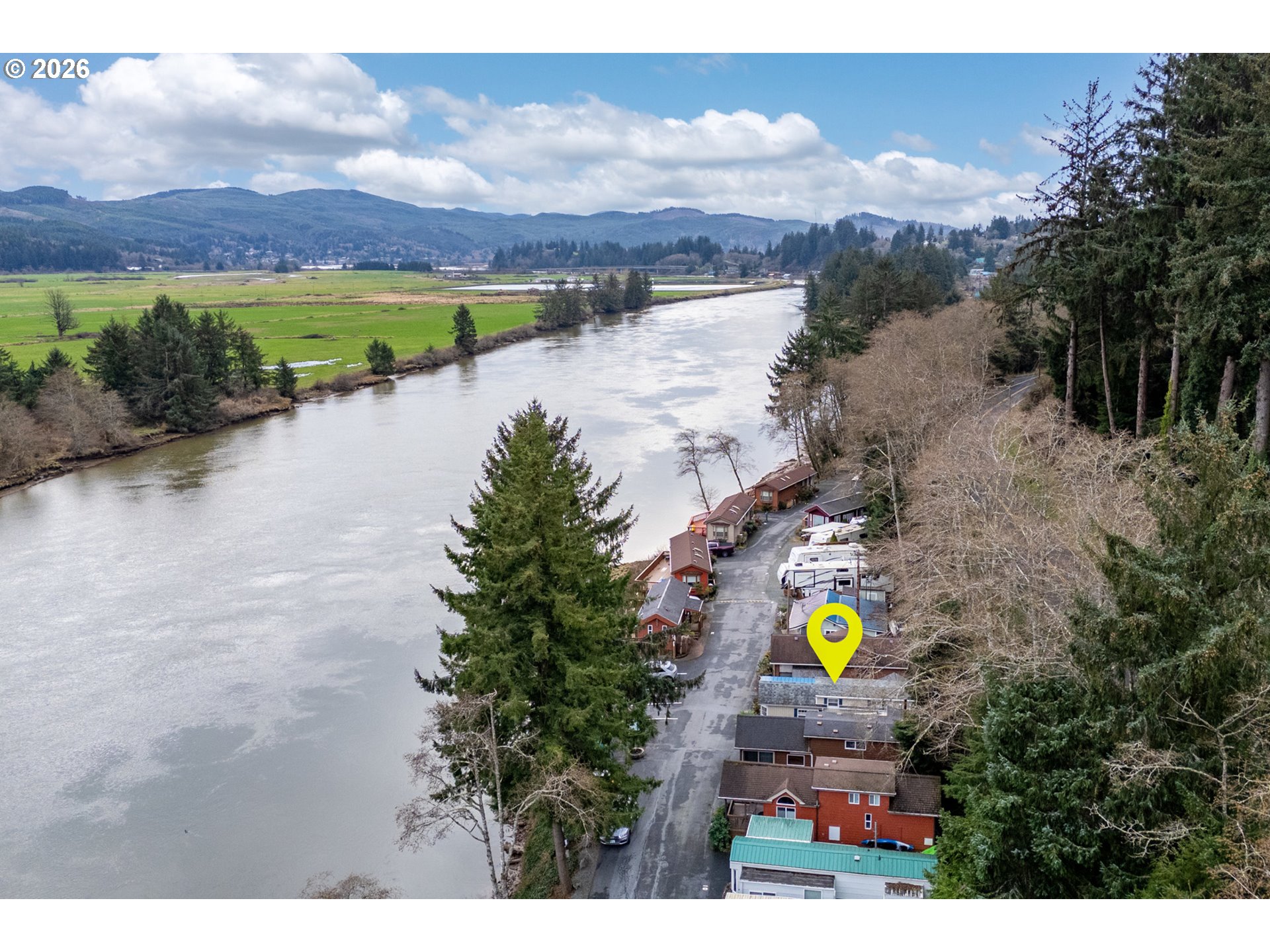 37395 North Fork Road, Unit 13 Nehalem, OR 97131 - Photo 3 of 34 a view of a city with a lake view