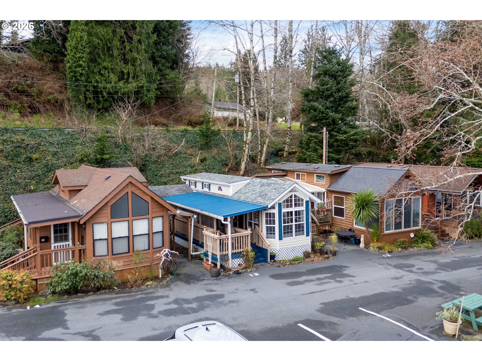 37395 North Fork Road, Unit 13 Nehalem, OR 97131 - Photo 33 of 34 a view of a town with brick building and large tree