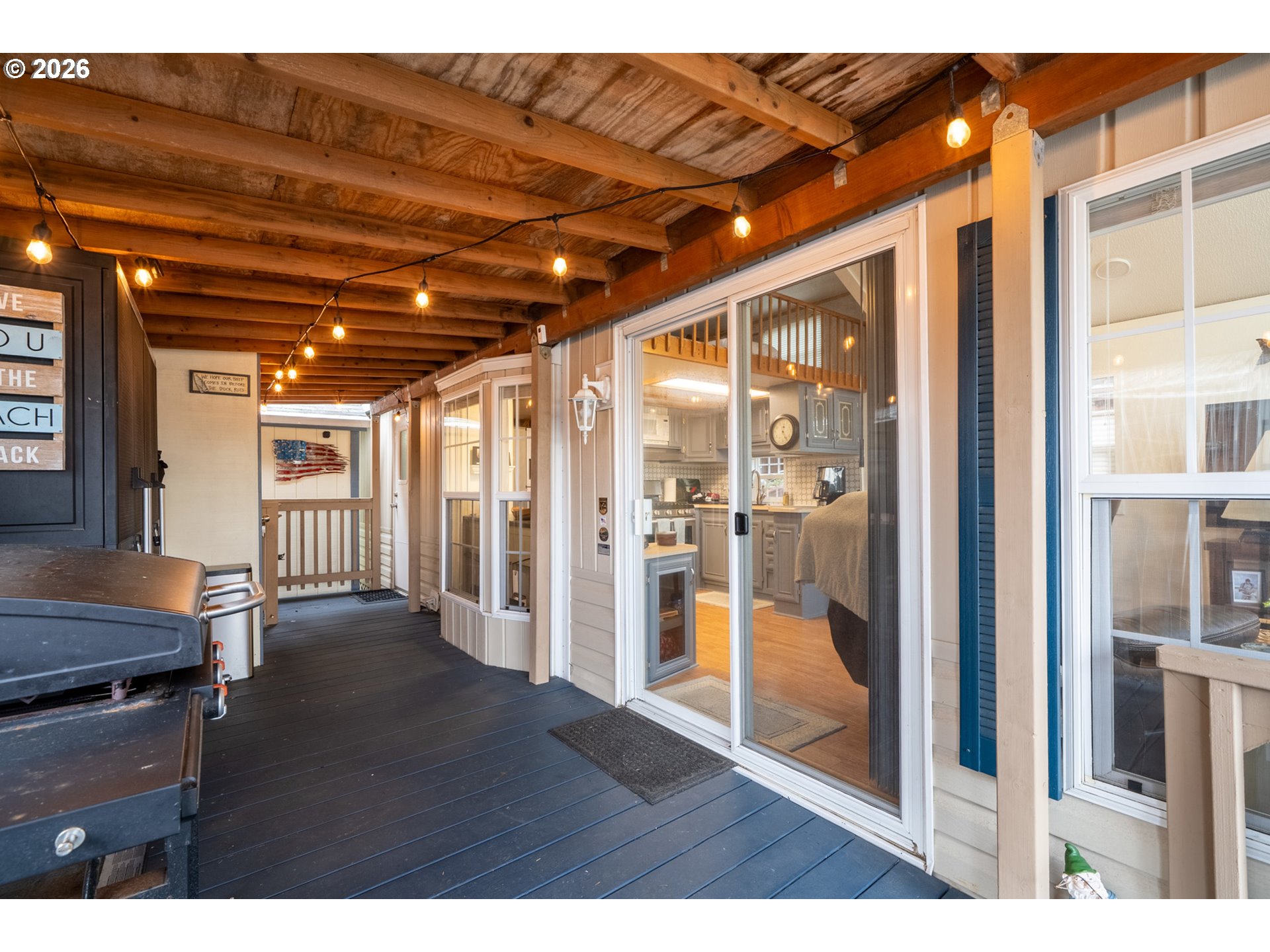 37395 North Fork Road, Unit 13 Nehalem, OR 97131 - Photo 5 of 34 a view of an empty room with glass door