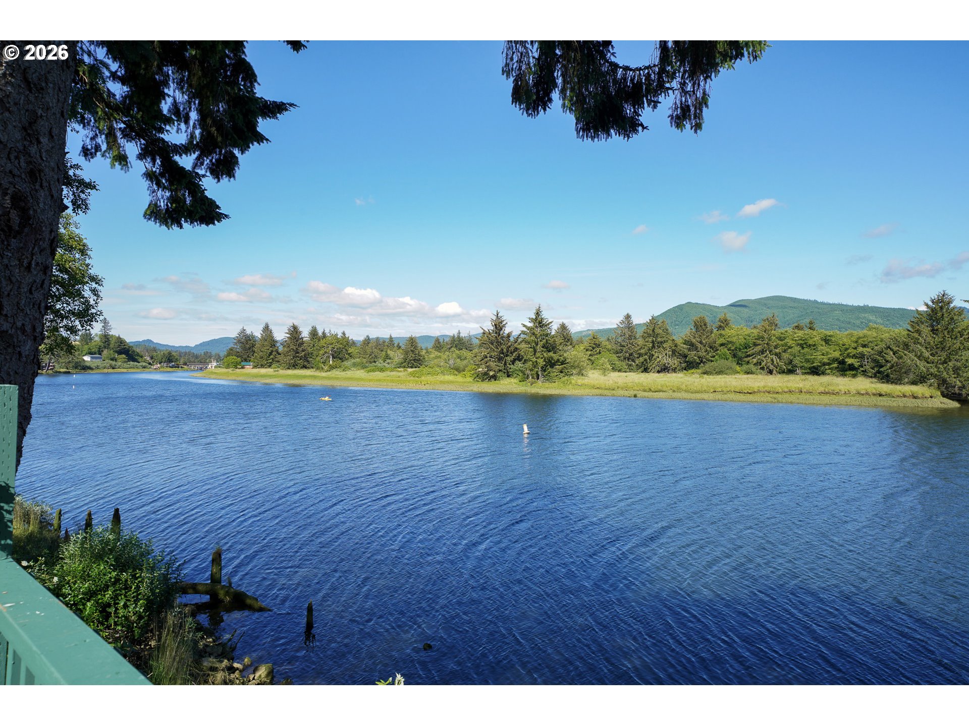 37395 North Fork Road, Unit 13 Nehalem, OR 97131 - Photo 7 of 34 a view of a lake with houses
