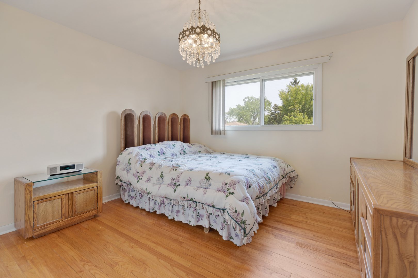 9363 Clancy Drive Des Plaines, IL 60016 - Photo 11 of 27 a bed sitting in a bedroom next to a window