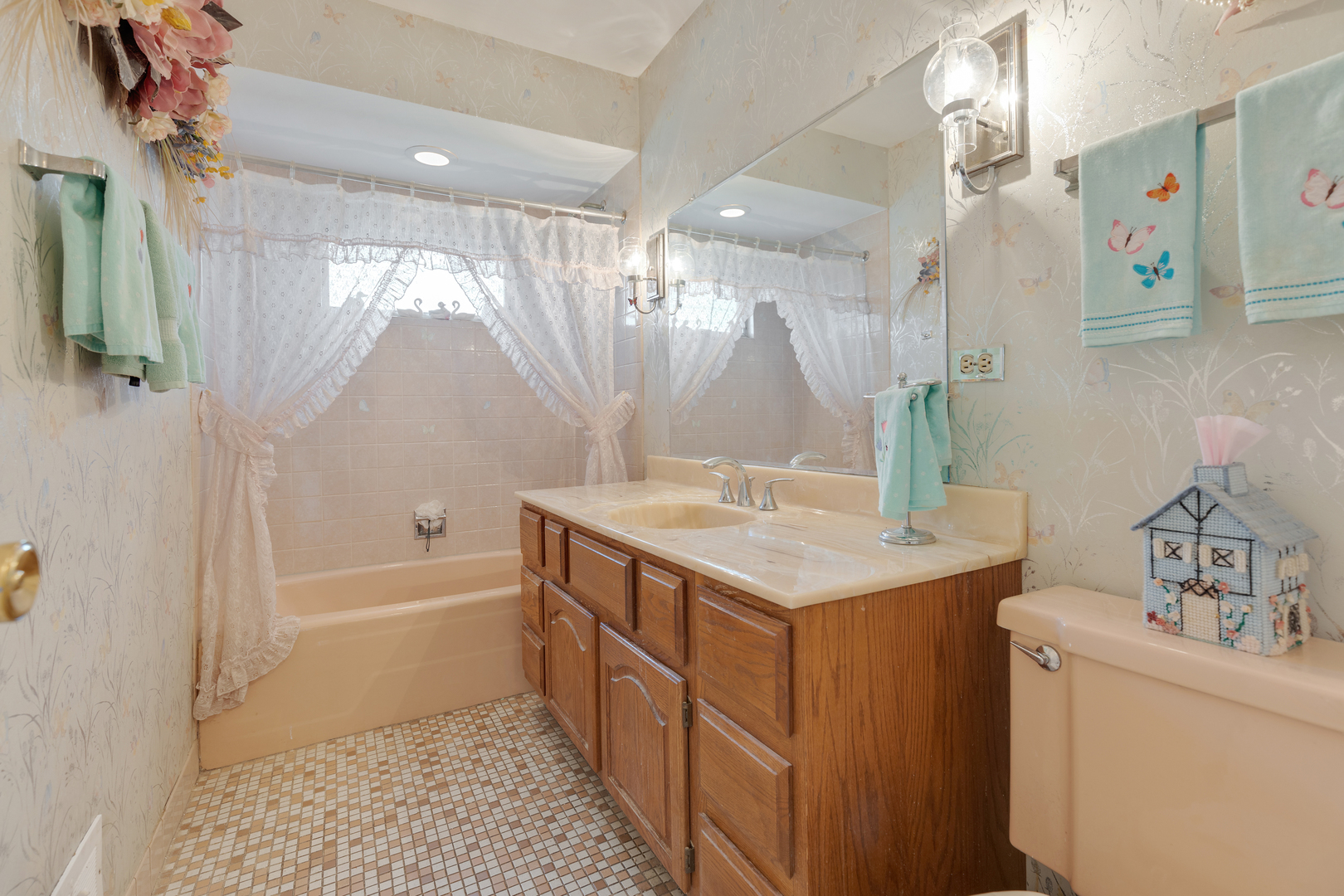 9363 Clancy Drive Des Plaines, IL 60016 - Photo 12 of 27 a bathroom with a sink a toilet and shower