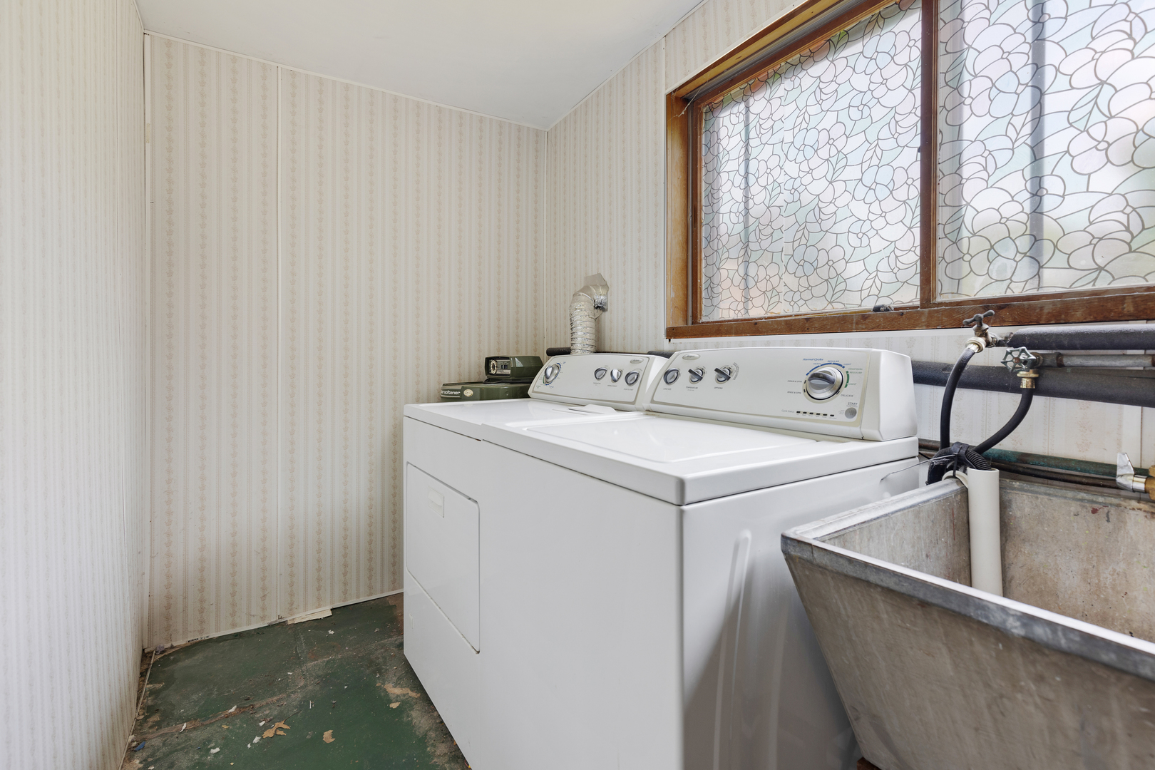 9363 Clancy Drive Des Plaines, IL 60016 - Photo 19 of 27 a utility room with dryer and washer
