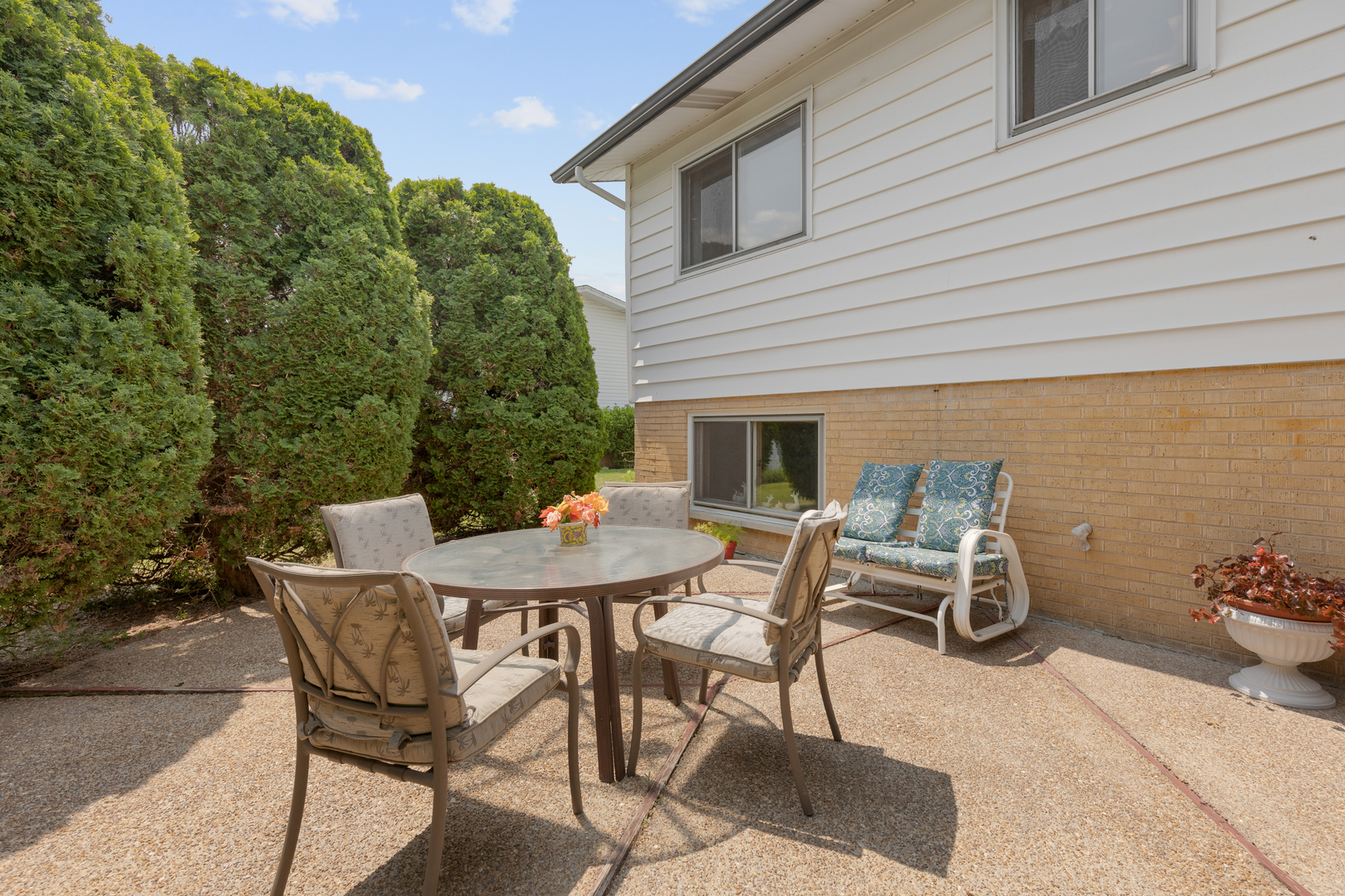 9363 Clancy Drive Des Plaines, IL 60016 - Photo 23 of 27 a view of a patio with table and chairs and potted plants