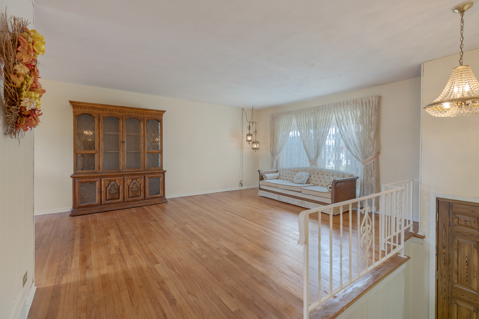 9363 Clancy Drive Des Plaines, IL 60016 - Photo 3 of 27 a view of empty room with wooden floor and fan