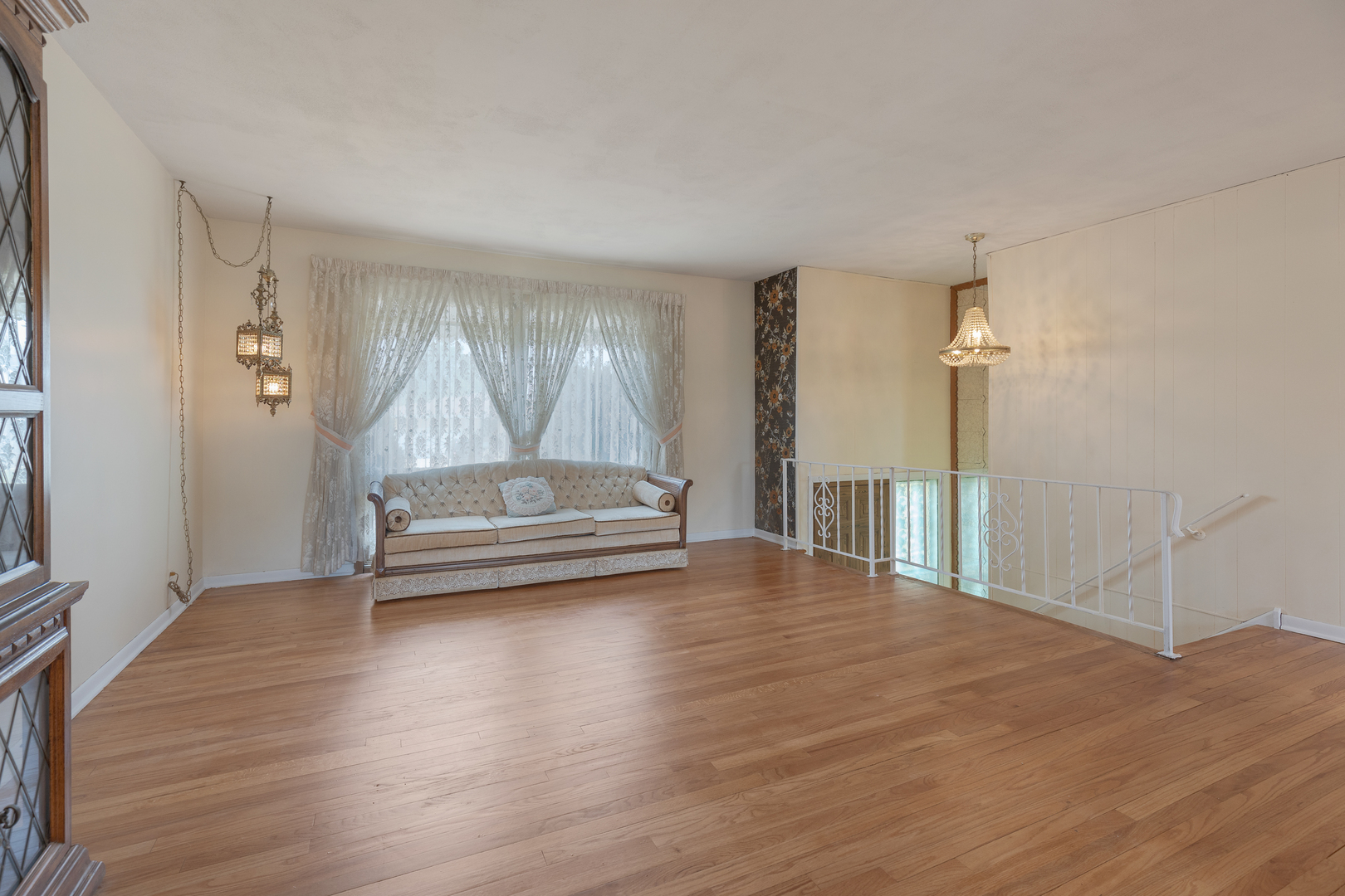 9363 Clancy Drive Des Plaines, IL 60016 - Photo 5 of 27 a view of a livingroom with wooden floor and a fireplace
