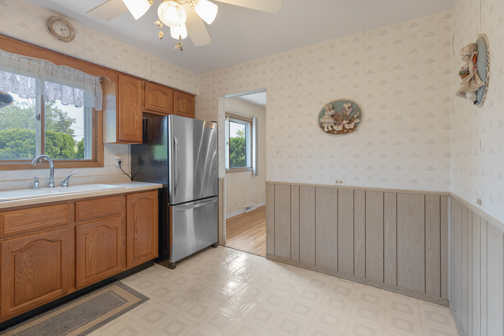 9363 Clancy Drive Des Plaines, IL 60016 - Photo 10 of 27 a kitchen with stainless steel appliances a refrigerator and a sink
