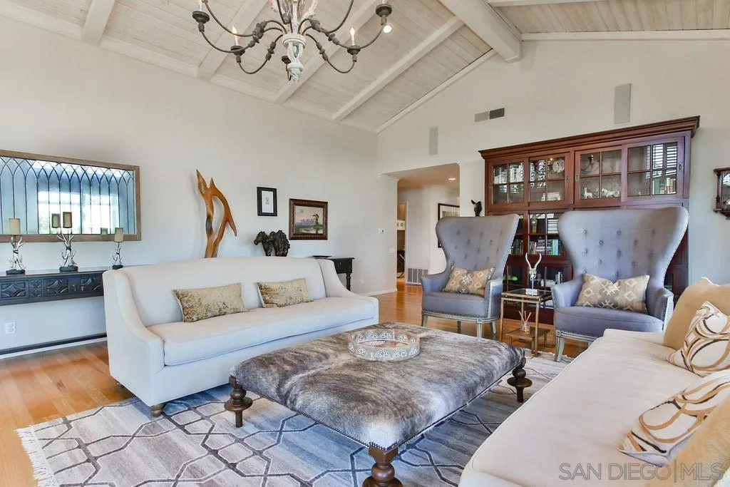 17695 Valle Verde Road Poway, CA 92064 - Photo 11 of 63 a living room with furniture a chandelier and a wooden floor