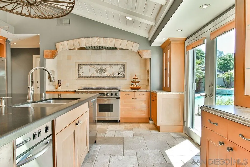 17695 Valle Verde Road Poway, CA 92064 - Photo 21 of 63 a kitchen with a stove a sink and a refrigerator