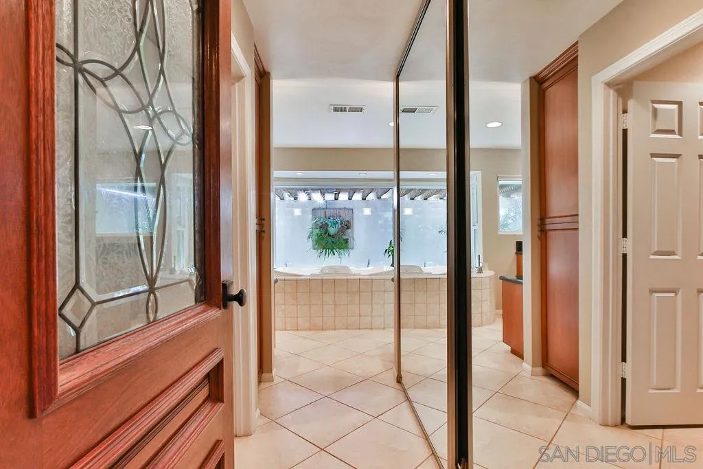 17695 Valle Verde Road Poway, CA 92064 - Photo 27 of 63 a view of a glass door and the balcony next to a yard