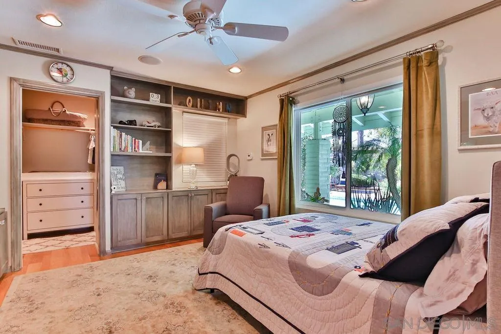 17695 Valle Verde Road Poway, CA 92064 - Photo 32 of 63 a bedroom with a bed and a window