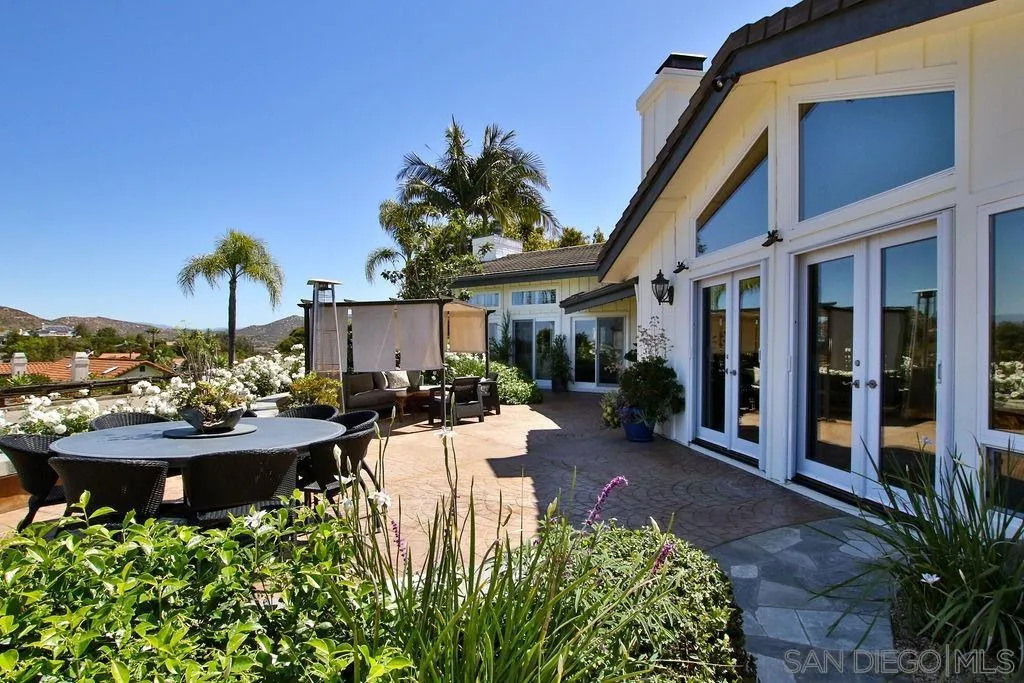17695 Valle Verde Road Poway, CA 92064 - Photo 51 of 63 a view of a patio with table and chairs and potted plants
