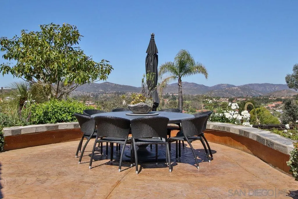 17695 Valle Verde Road Poway, CA 92064 - Photo 52 of 63 a view of a chairs and table in the patio