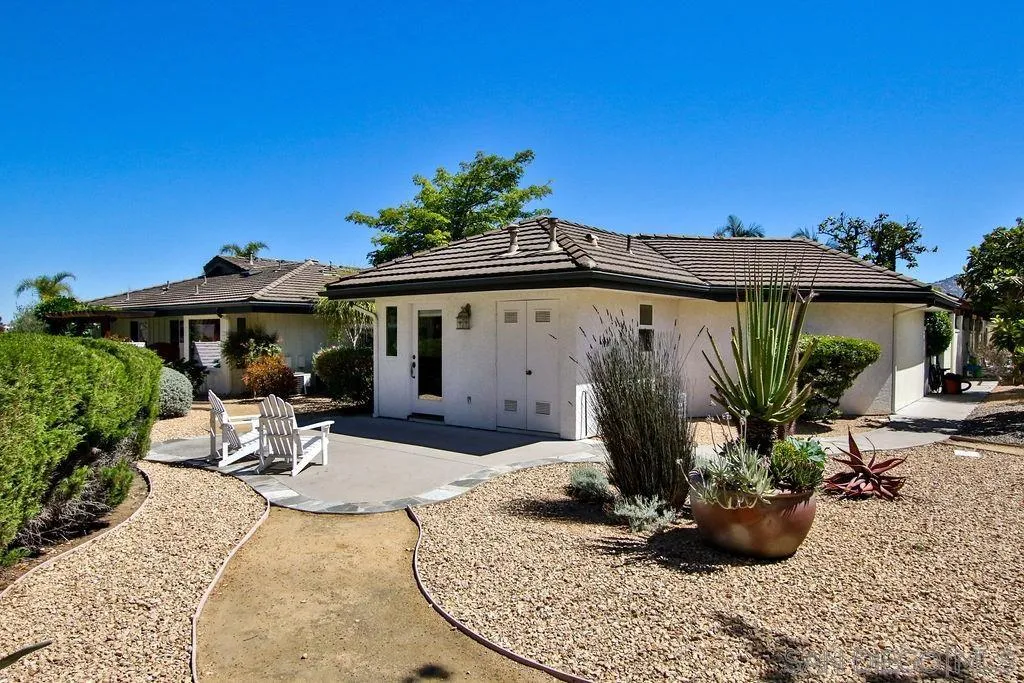 17695 Valle Verde Road Poway, CA 92064 - Photo 57 of 63 a view of a house with backyard sitting area and porch