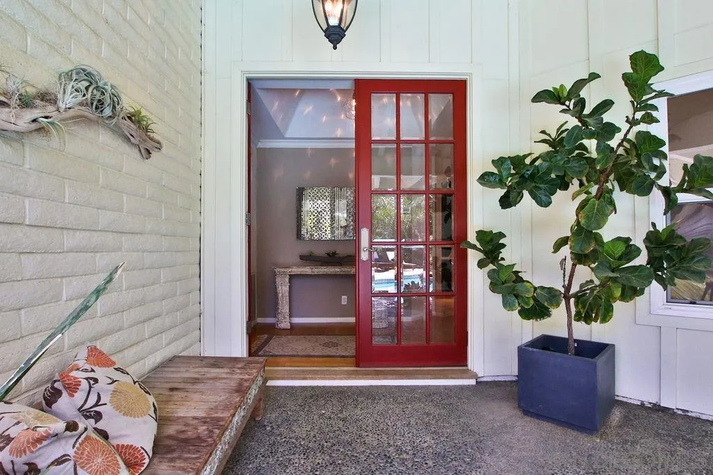 17695 Valle Verde Road Poway, CA 92064 - Photo 8 of 63 a potted plant sitting in front of a door