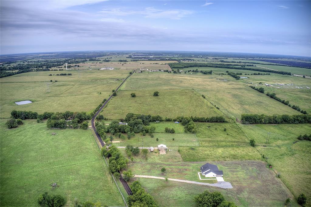 868 County Road 23940 Brookston, TX 75421 - Photo 19 of 29 a view of a lake with a yard
