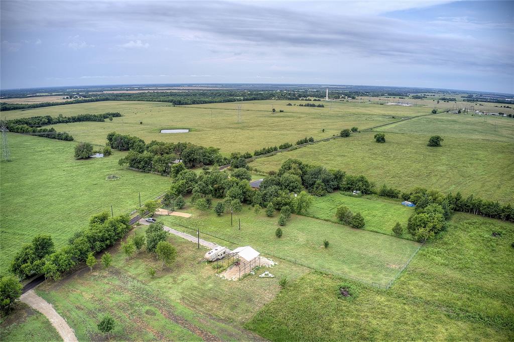 868 County Road 23940 Brookston, TX 75421 - Photo 20 of 29 a view of a water pond with green field
