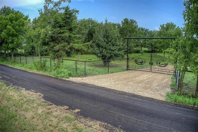 a view of a park with large trees