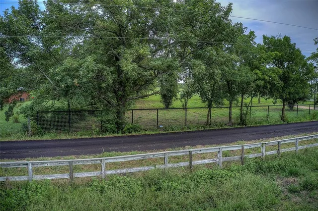 a view of a garden from a balcony