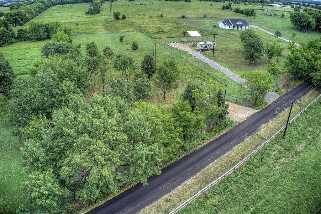 868 County Road 23940 Brookston, TX 75421 - Photo 7 of 29 a view of a garden from a balcony