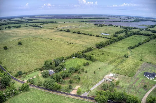 a view of a swimming pool with a yard