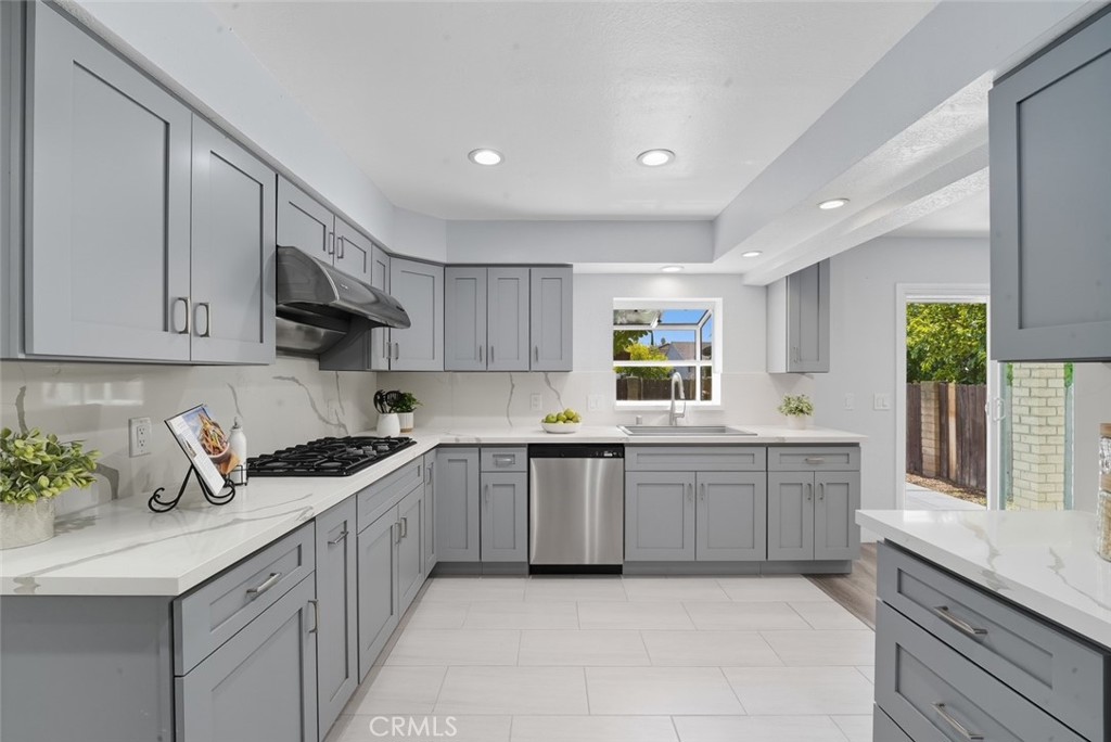 916 Othello Street Arcadia, CA 91006 - Photo 14 of 56 a kitchen with sink a microwave and cabinets