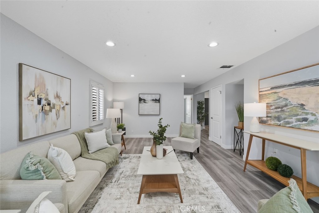 916 Othello Street Arcadia, CA 91006 - Photo 17 of 56 a living room with furniture a rug and white walls