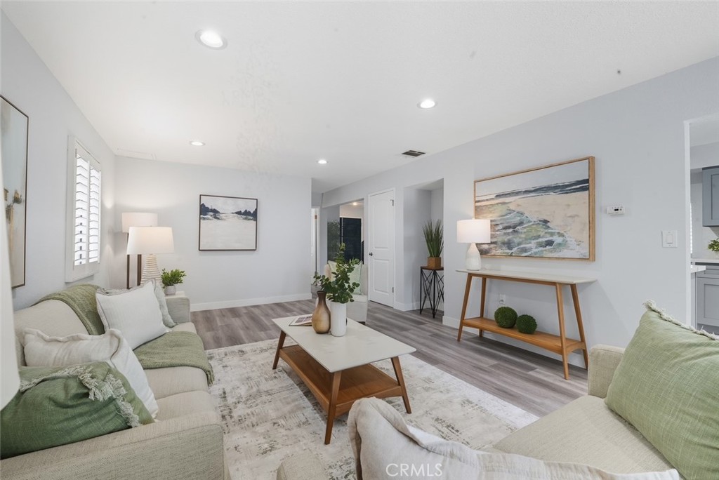 916 Othello Street Arcadia, CA 91006 - Photo 18 of 56 a living room with furniture a table and a painting on the wall