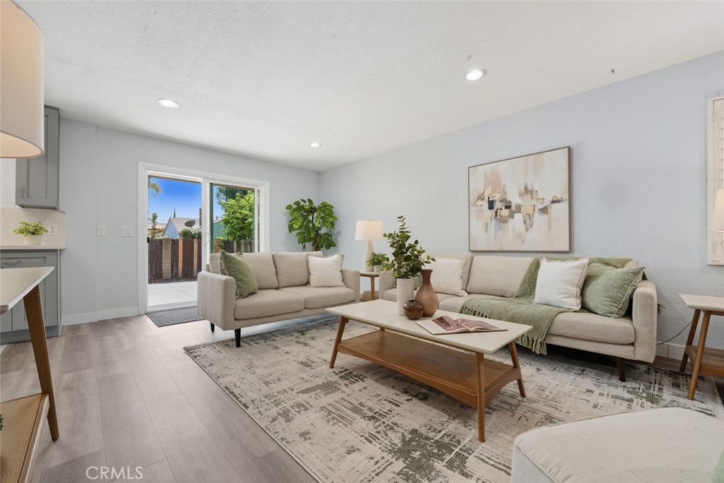 916 Othello Street Arcadia, CA 91006 - Photo 21 of 56 a living room with furniture a rug and a painting