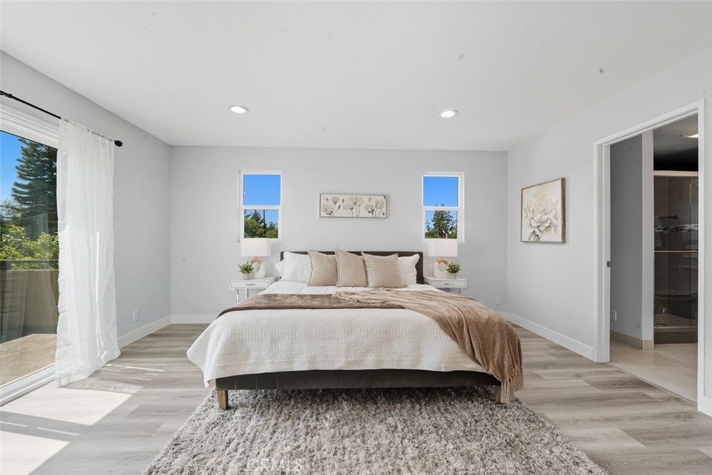 916 Othello Street Arcadia, CA 91006 - Photo 36 of 56 a bedroom with a large bed and a wooden floor