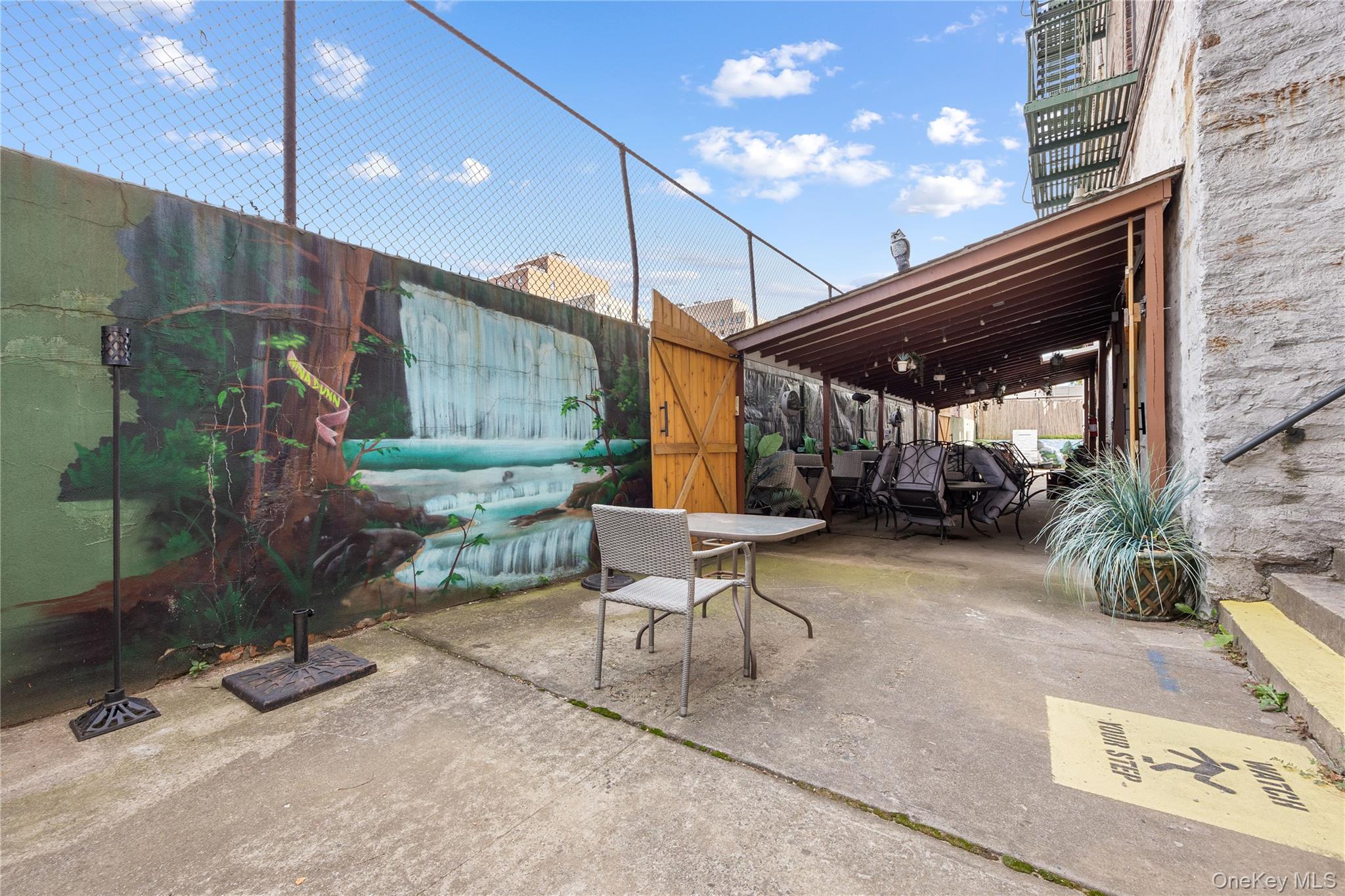 1670 Longfellow Avenue, Unit 3J Bronx, NY 10460 - Photo 20 of 23 a patio with a table and chairs and potted plants
