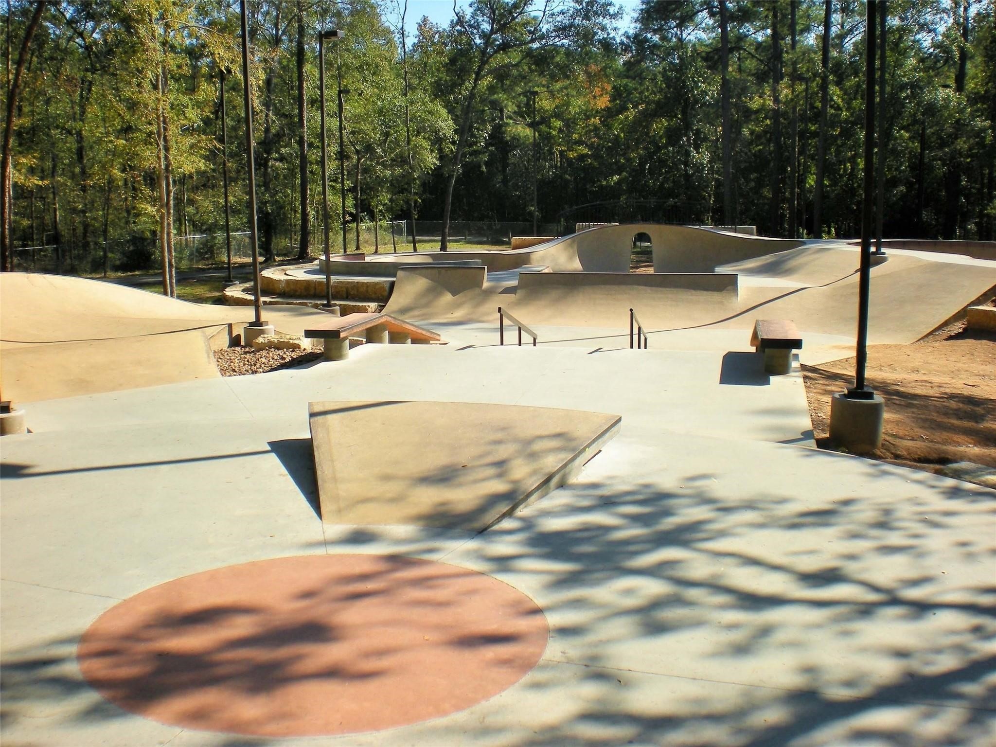 518 Clinton Street, Unit B Conroe, TX 77301 - Photo 45 of 50 a view of a swimming pool with a patio