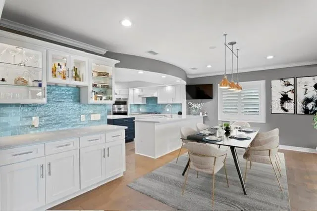 a kitchen with a sink and a large window