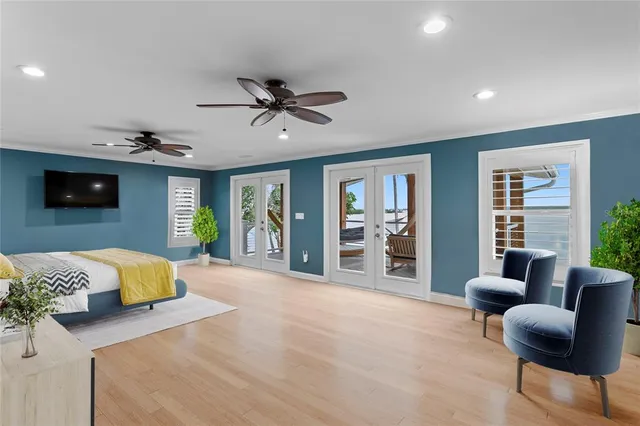 a room with gym equipment and large windows