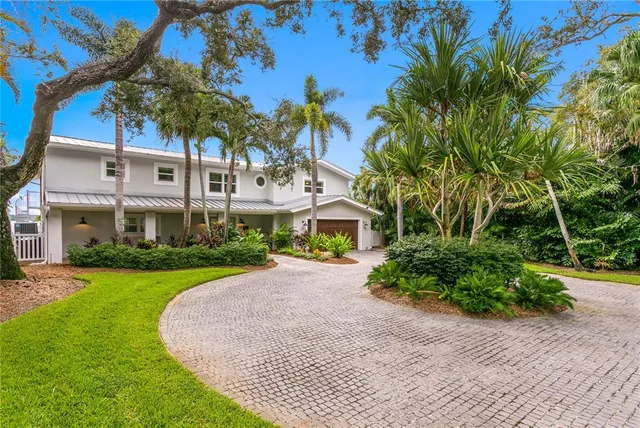 a view of an chairs and table in patio