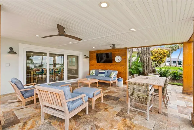 a view of a chairs and table on the patio