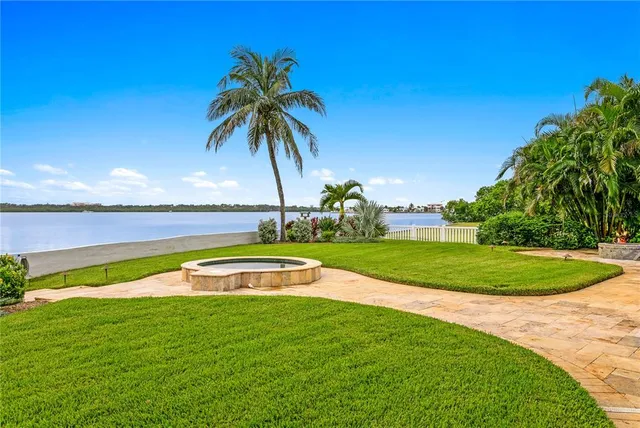a view of a patio with a table and chairs