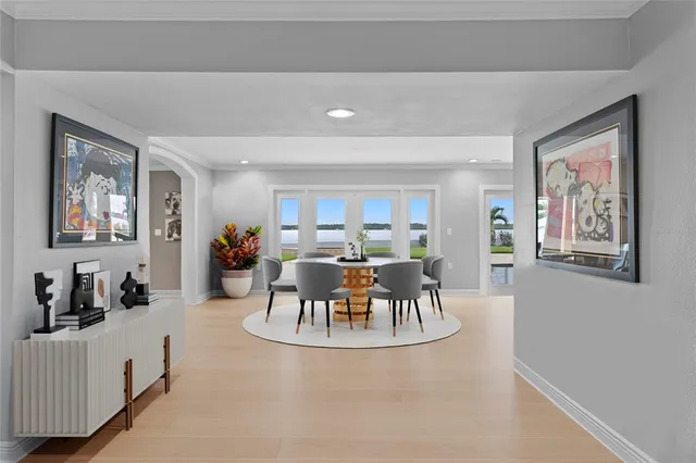 a view of a dining room with furniture and chandelier