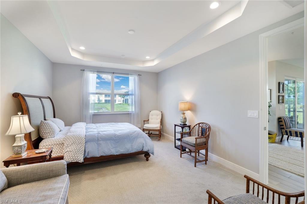 2647 Seychelles Circle, Unit 2204 Naples, FL 34112 - Photo 12 of 29 a bedroom with bed and window
