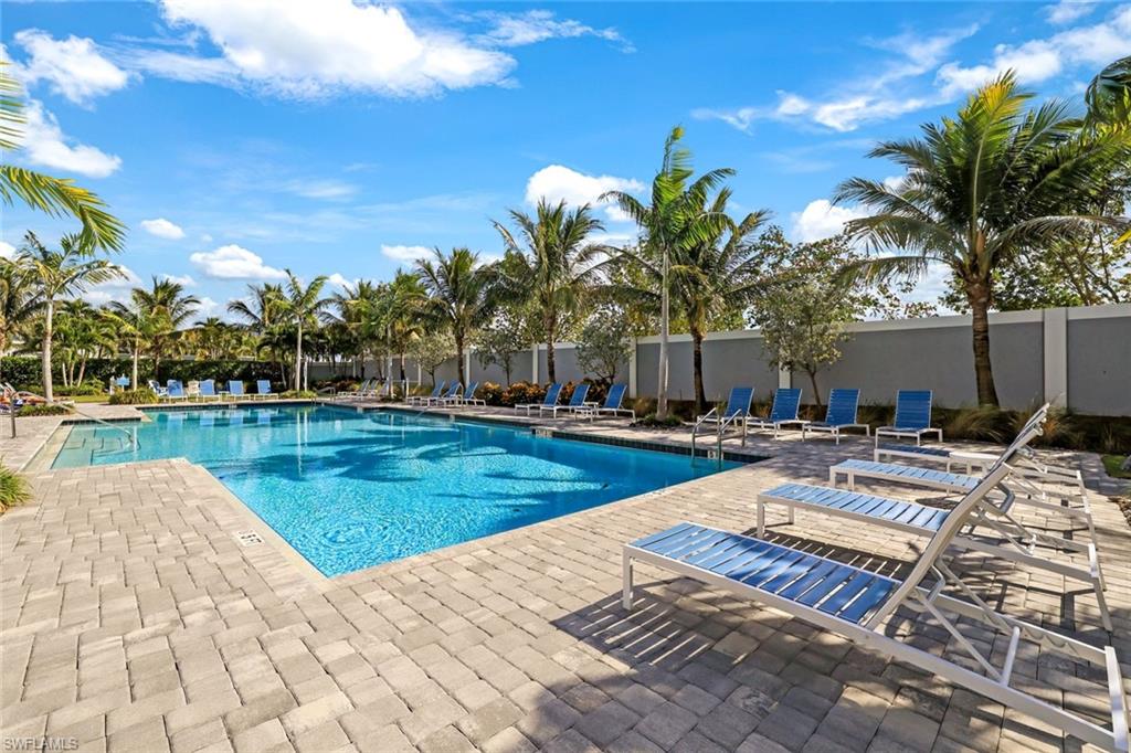 2647 Seychelles Circle, Unit 2204 Naples, FL 34112 - Photo 21 of 29 a view of swimming pool with lounge chair