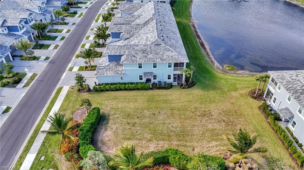 2647 Seychelles Circle, Unit 2204 Naples, FL 34112 - Photo 28 of 29 a aerial view of a house with a garden