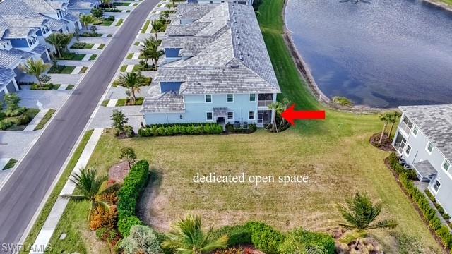 2647 Seychelles Circle, Unit 2204 Naples, FL 34112 - Photo 3 of 29 a view of swimming pool with a yard