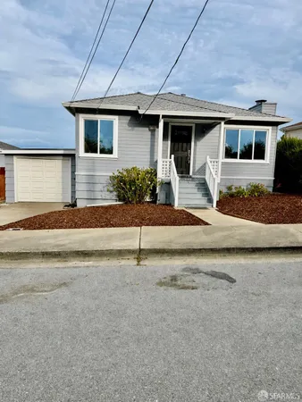 front view of a house with a patio