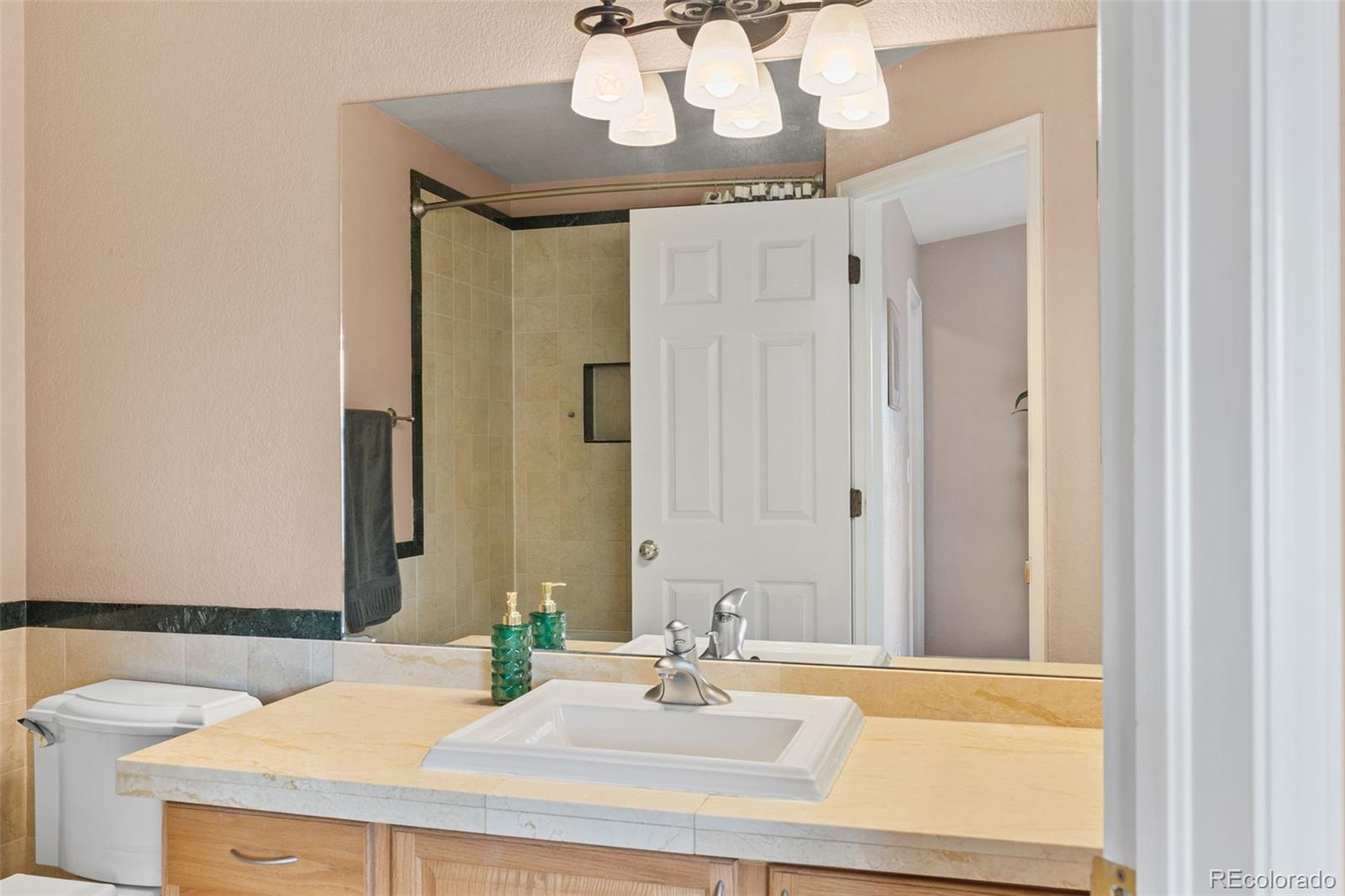 1189 Fall River Circle Longmont, CO 80504 - Photo 24 of 46 a bathroom with a sink and a mirror